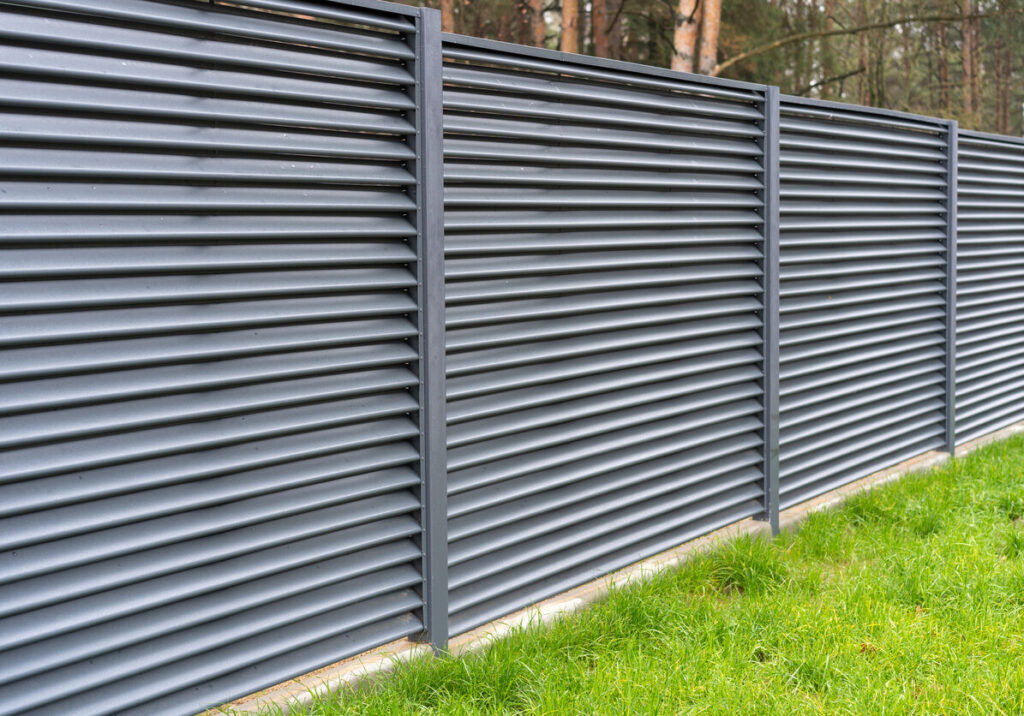 blank metal fence in the village.